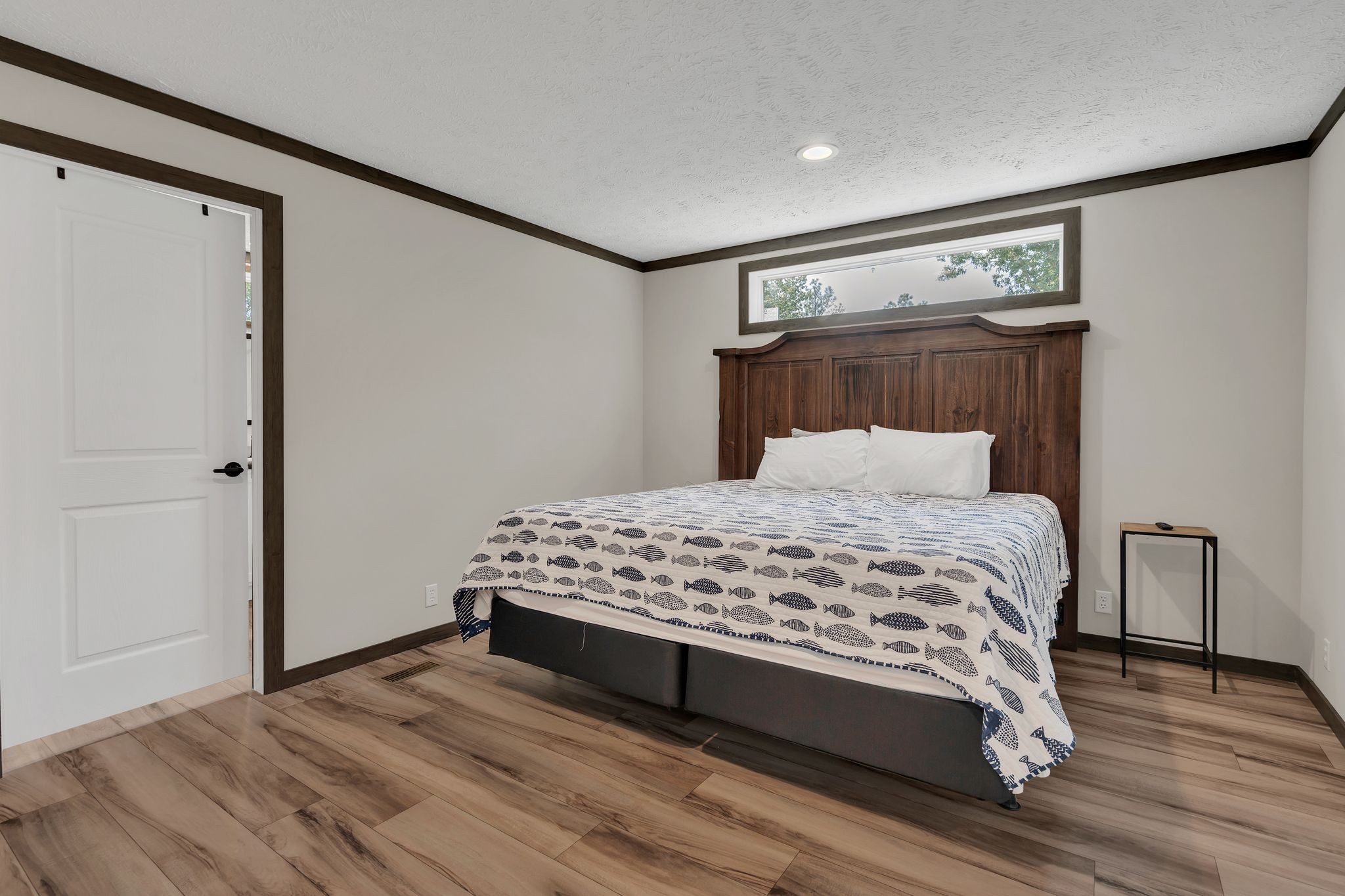 351 Wismer Road Camden, TN 38320 - Photo 19 of 27 a bedroom with a bed and wooden floor