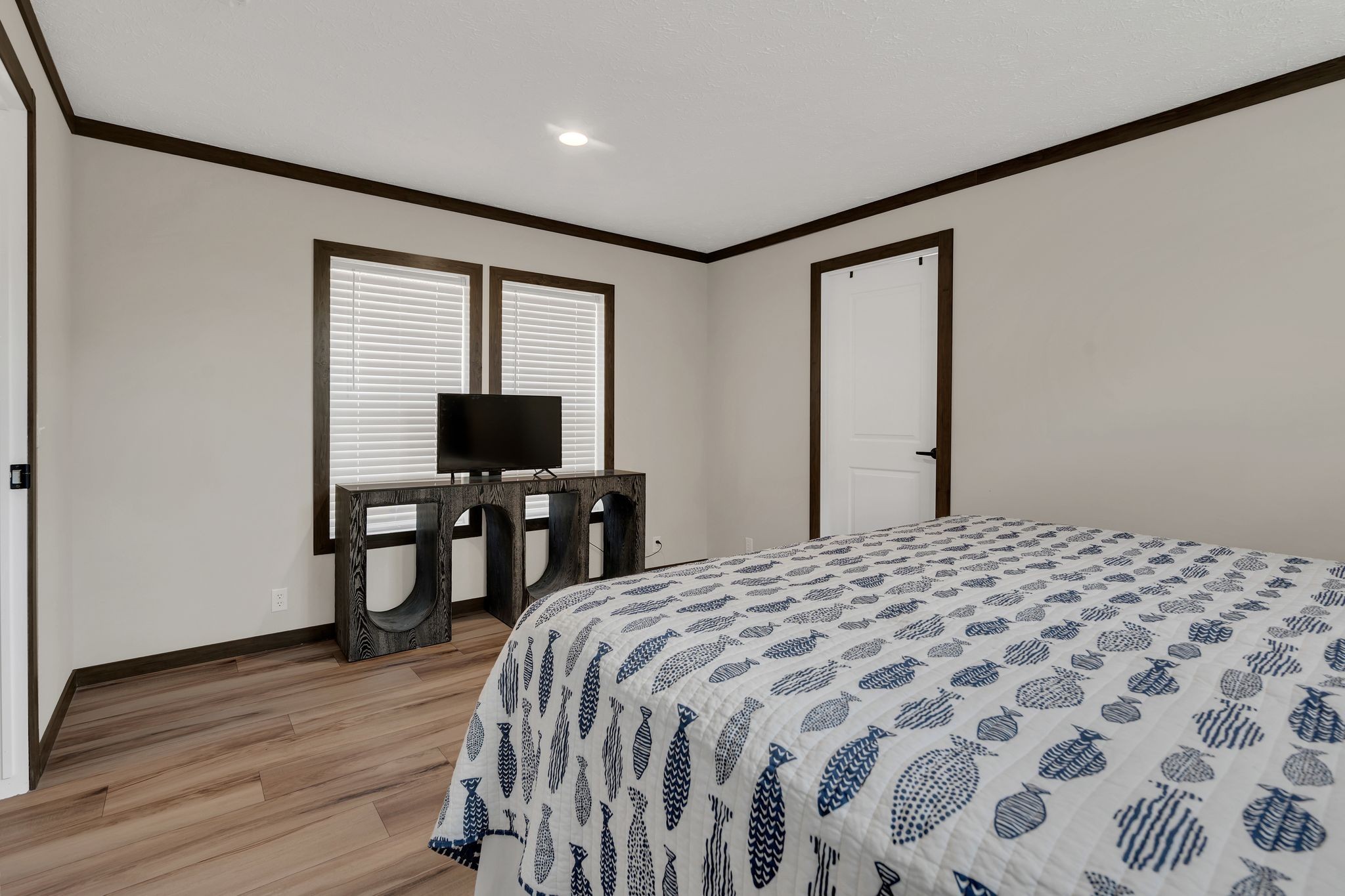 351 Wismer Road Camden, TN 38320 - Photo 20 of 27 a bedroom with a bed and wooden floor