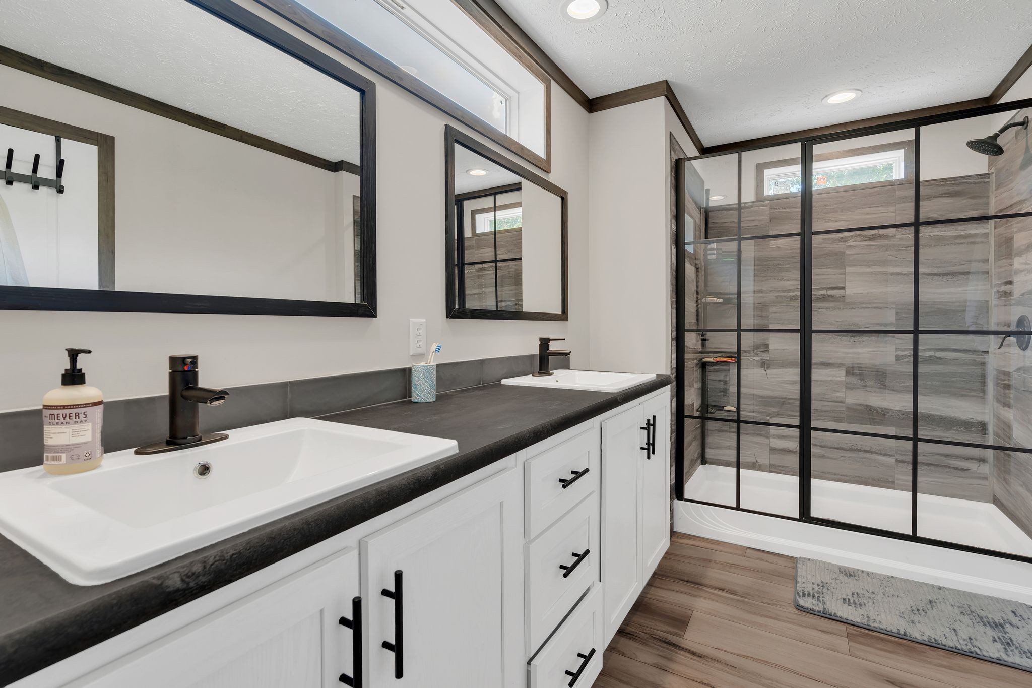 351 Wismer Road Camden, TN 38320 - Photo 21 of 27 a bathroom with a double vanity sink and mirror