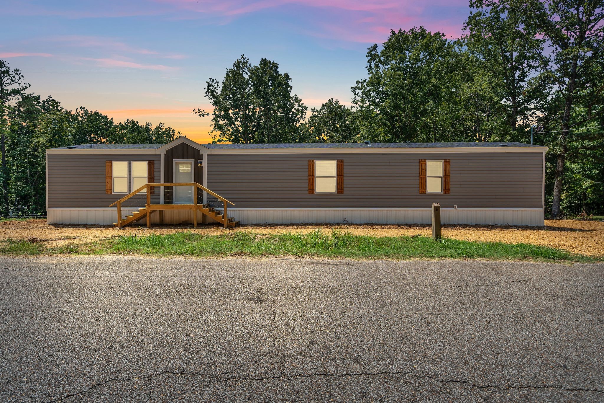 351 Wismer Road Camden, TN 38320 - Photo 4 of 27 a front view of a house with a yard and garage
