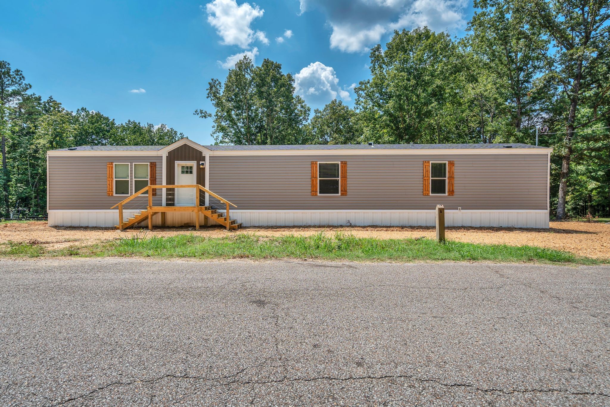 351 Wismer Road Camden, TN 38320 - Photo 5 of 27 a front view of a house with garden