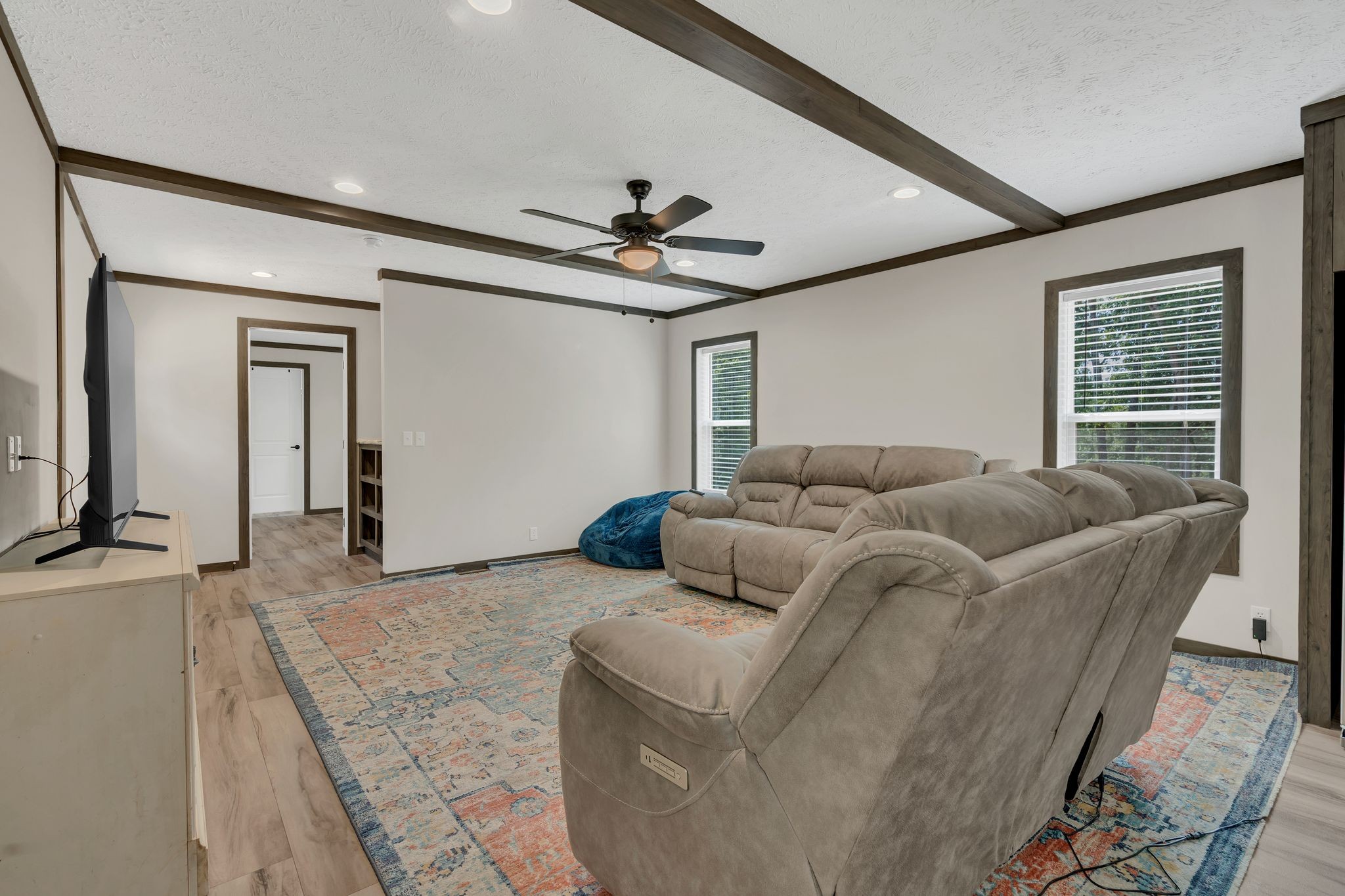 351 Wismer Road Camden, TN 38320 - Photo 10 of 27 a living room with furniture a ceiling fan and a rug