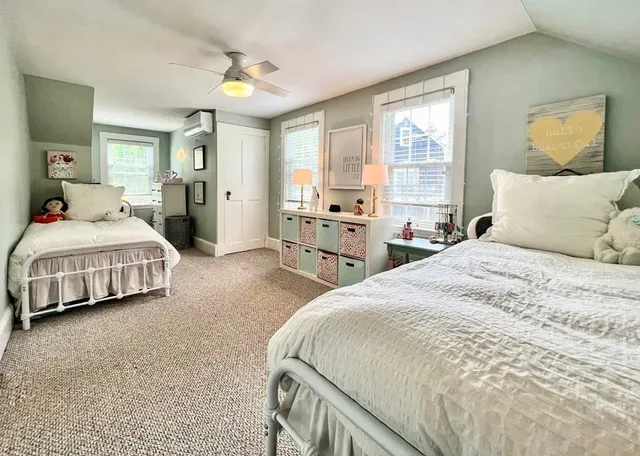 a spacious bedroom with a bed and window