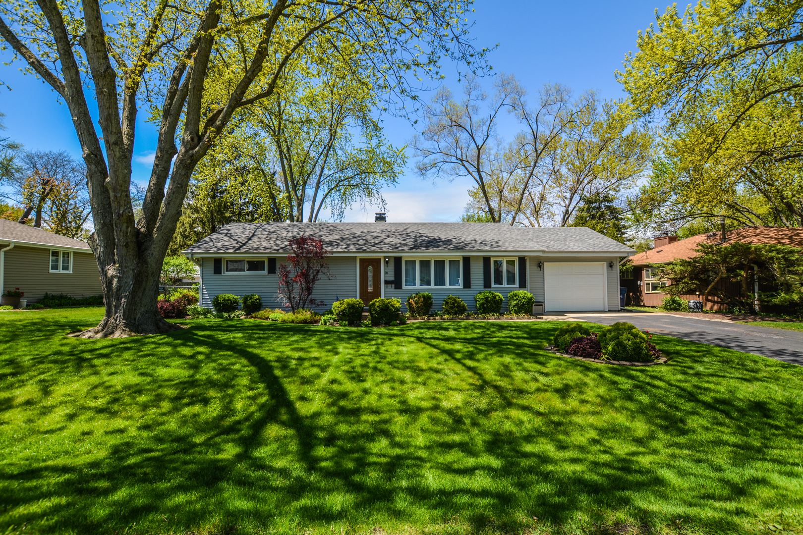 36 Johnathan Road Lake Zurich, IL 60047 - Photo 2 of 25 a front view of a house with a garden