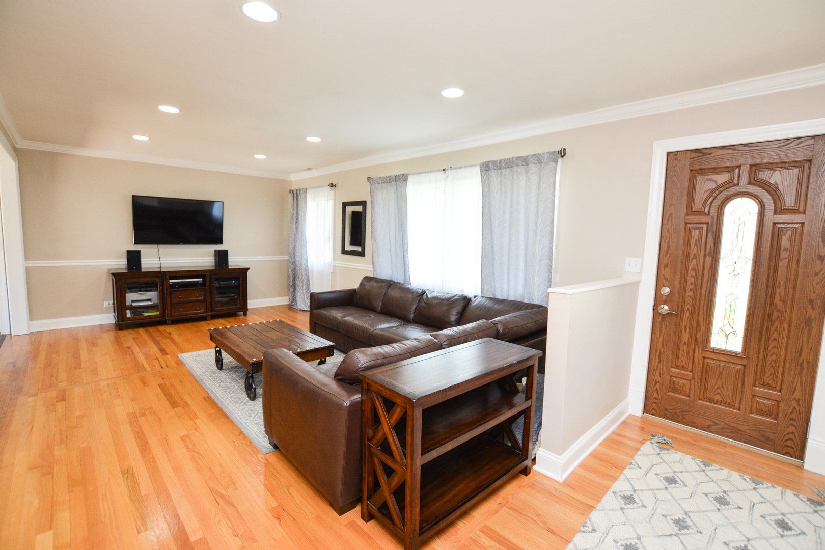 36 Johnathan Road Lake Zurich, IL 60047 - Photo 12 of 25 a living room with furniture and a flat screen tv