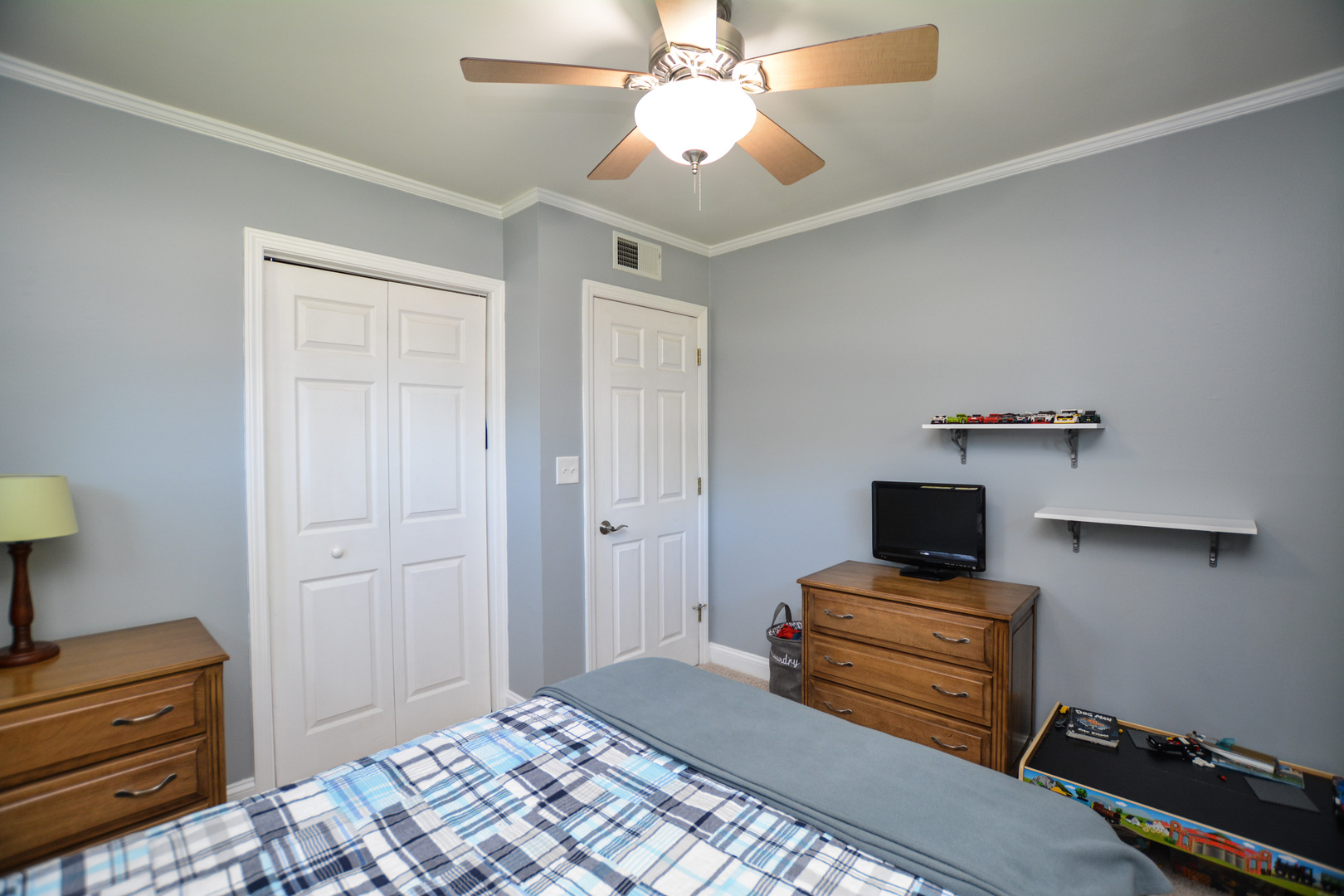 36 Johnathan Road Lake Zurich, IL 60047 - Photo 23 of 25 a bedroom with a bed and cabinets