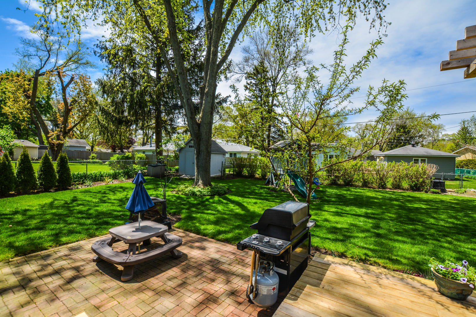36 Johnathan Road Lake Zurich, IL 60047 - Photo 6 of 25 a view of a backyard with sitting area and garden