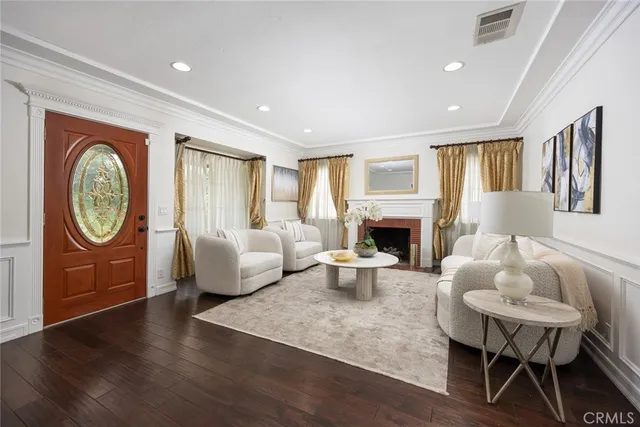 a living room with furniture a window and a fireplace