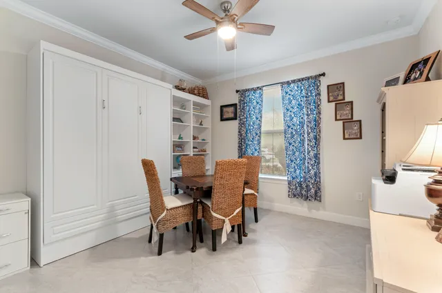 a dining room with furniture and window