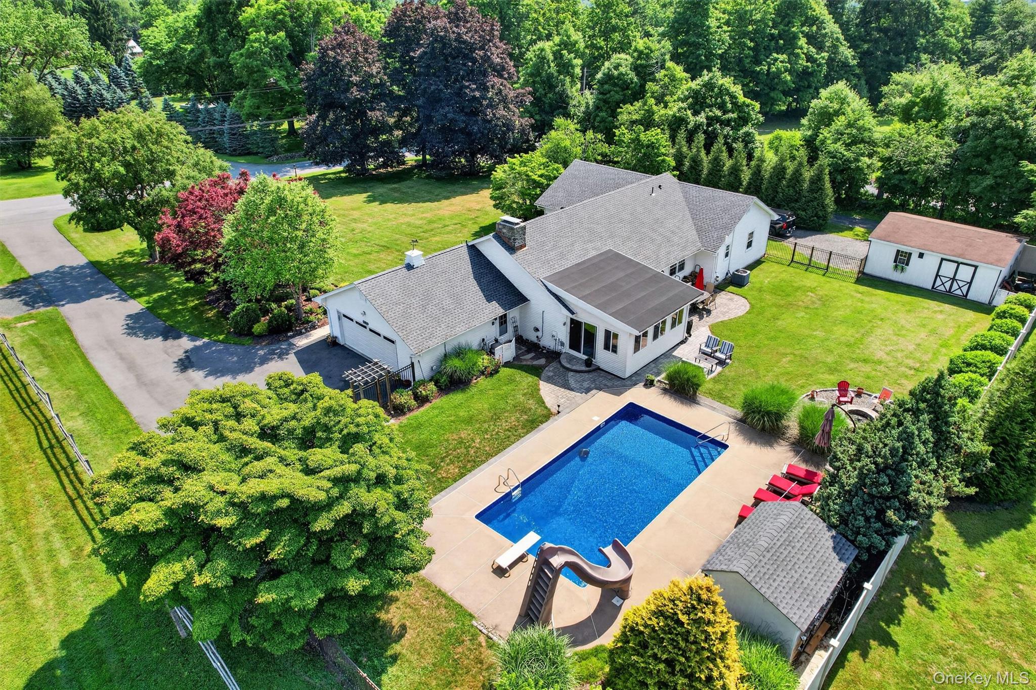 5 Hedges Road Warwick, NY 10990 - Photo 2 of 48 Set on 0.92 level and private acres, this Warwick property offers a spacious ranch home, inground pool, two garages, and a backyard designed for everyday enjoyment.