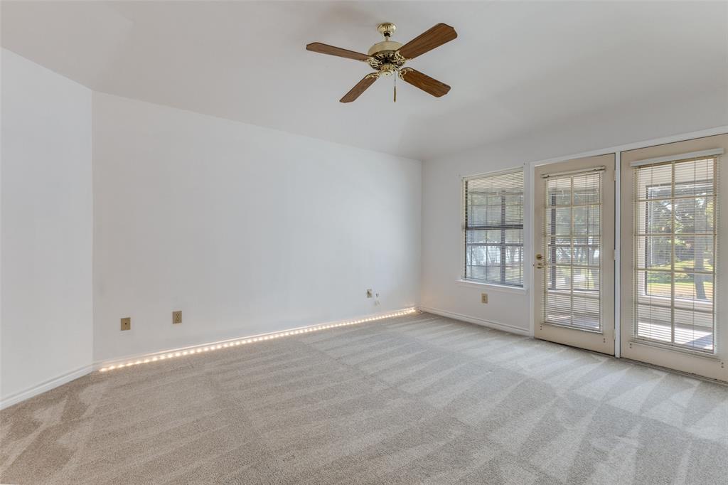9939 Waterfront Trail Rowlett, TX 75087 - Photo 17 of 25 wooden floor in an empty room with a window