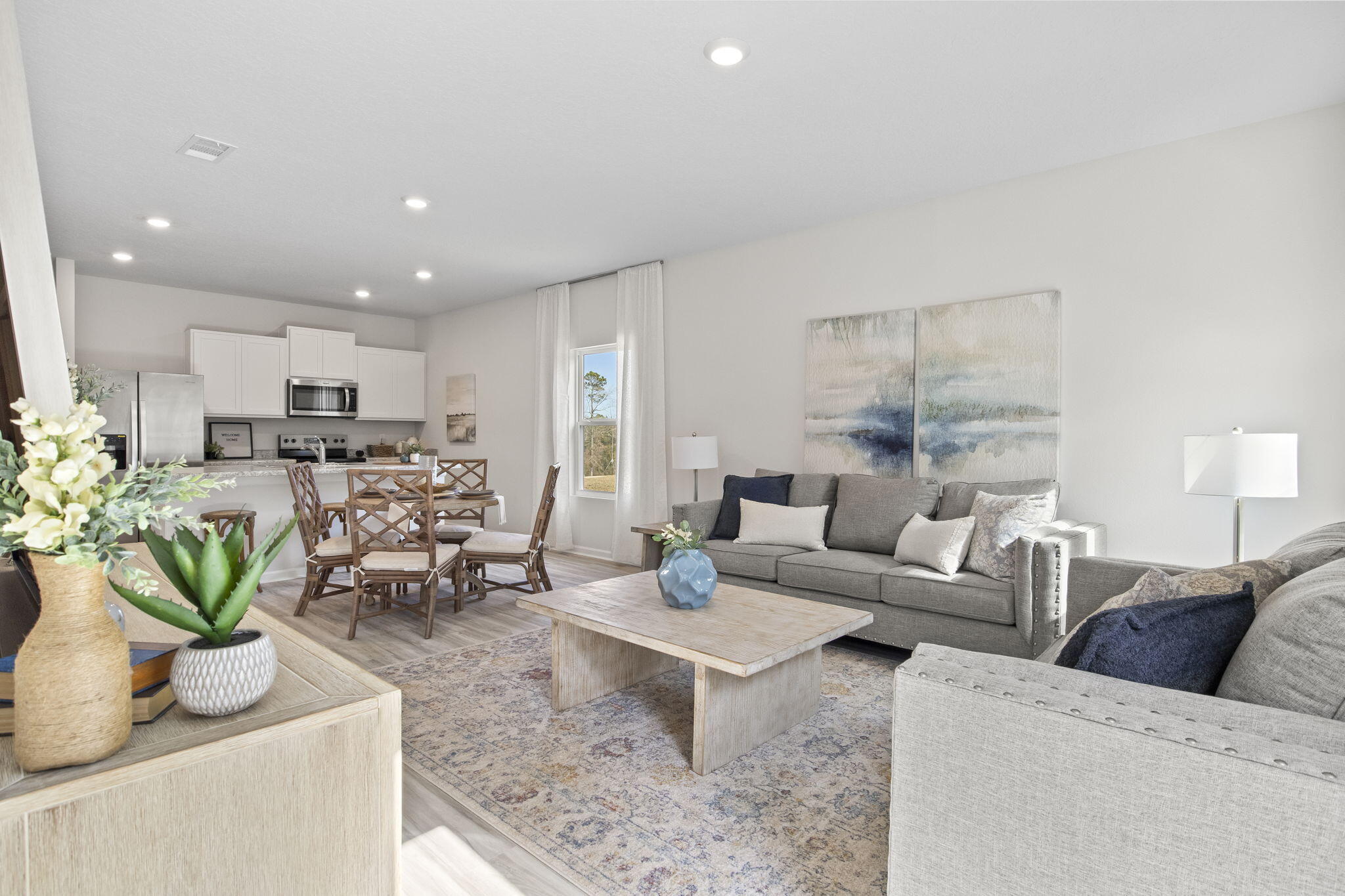 6533 Burleson Boulevard Crestview, FL 32539 - Photo 11 of 38 a living room with furniture and a view of kitchen
