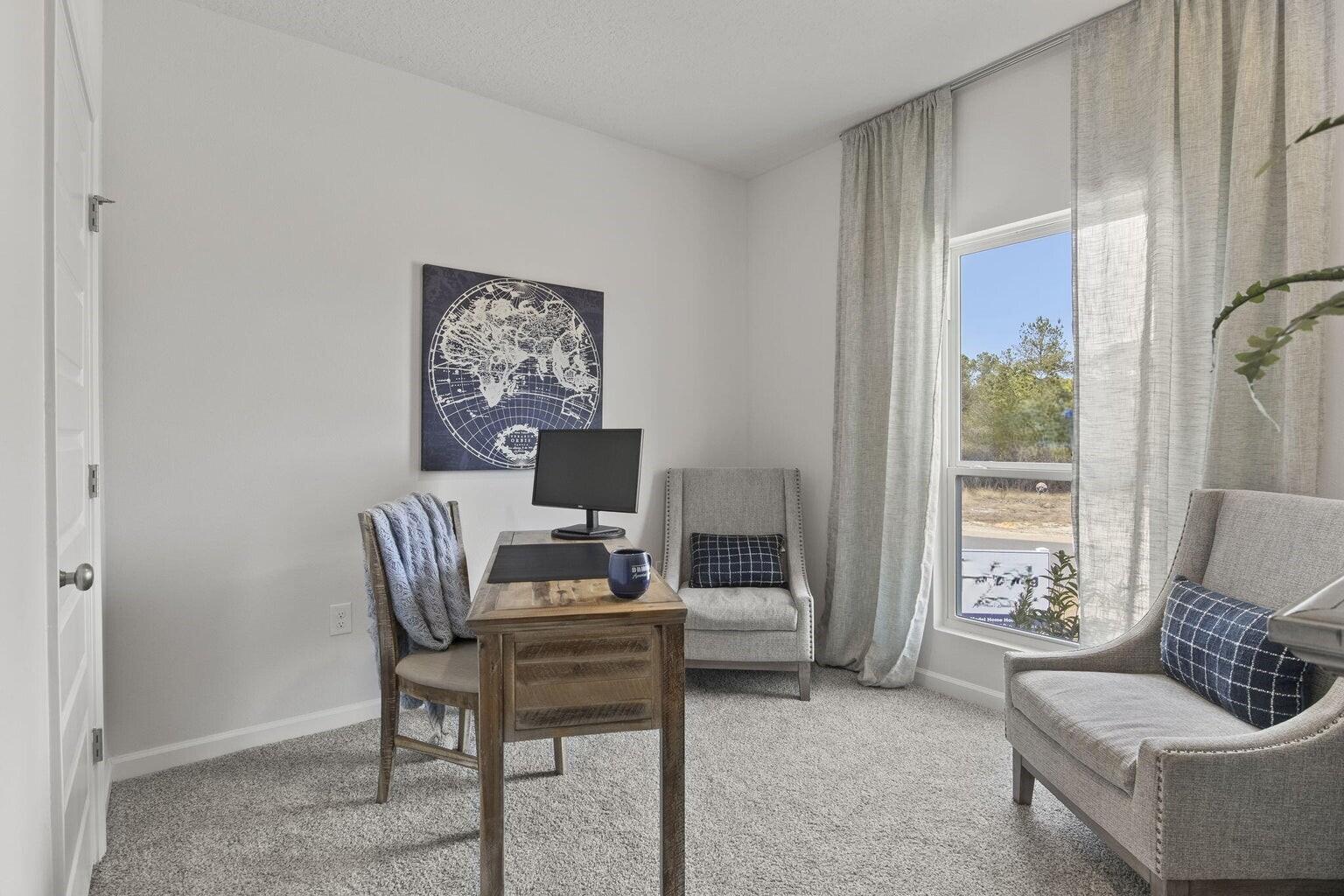 6533 Burleson Boulevard Crestview, FL 32539 - Photo 27 of 38 a work room with furniture and a window