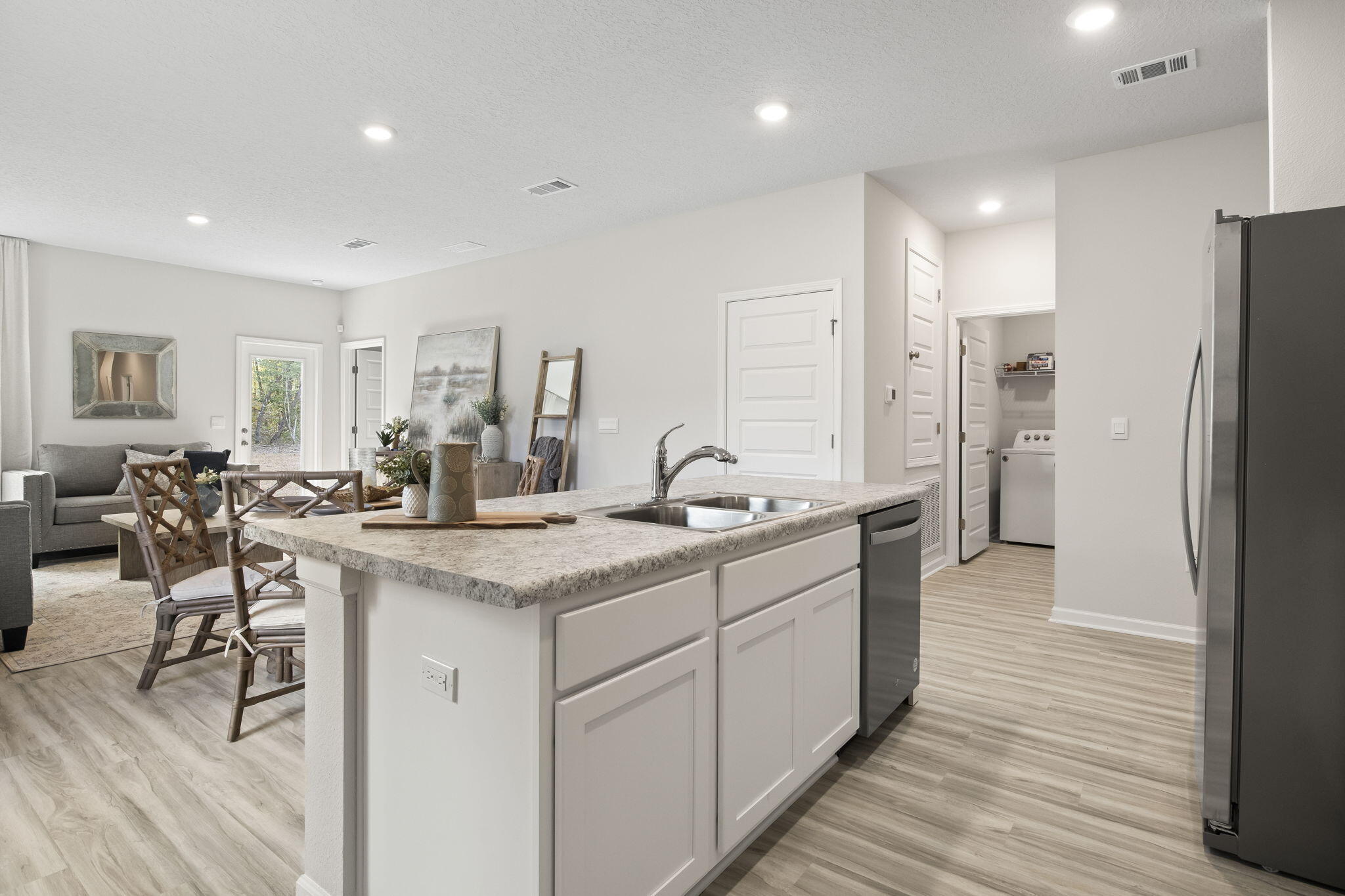 6533 Burleson Boulevard Crestview, FL 32539 - Photo 5 of 38 a large kitchen with a table and chairs