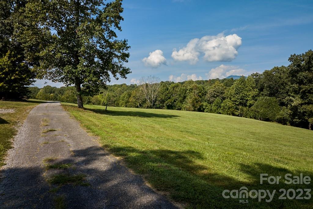 574 Golden Road Columbus, NC 28722 - Photo 13 of 48 a view of a golf course with a lake