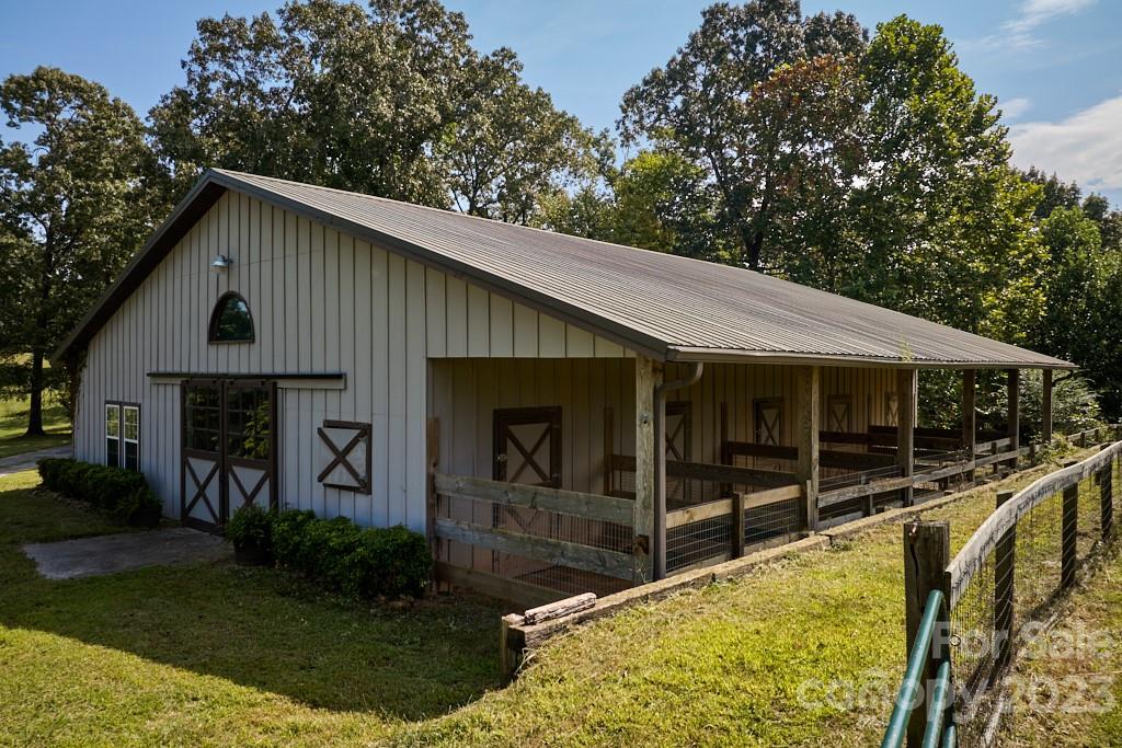 574 Golden Road Columbus, NC 28722 - Photo 15 of 48 a view of house with backyard and outdoor seating
