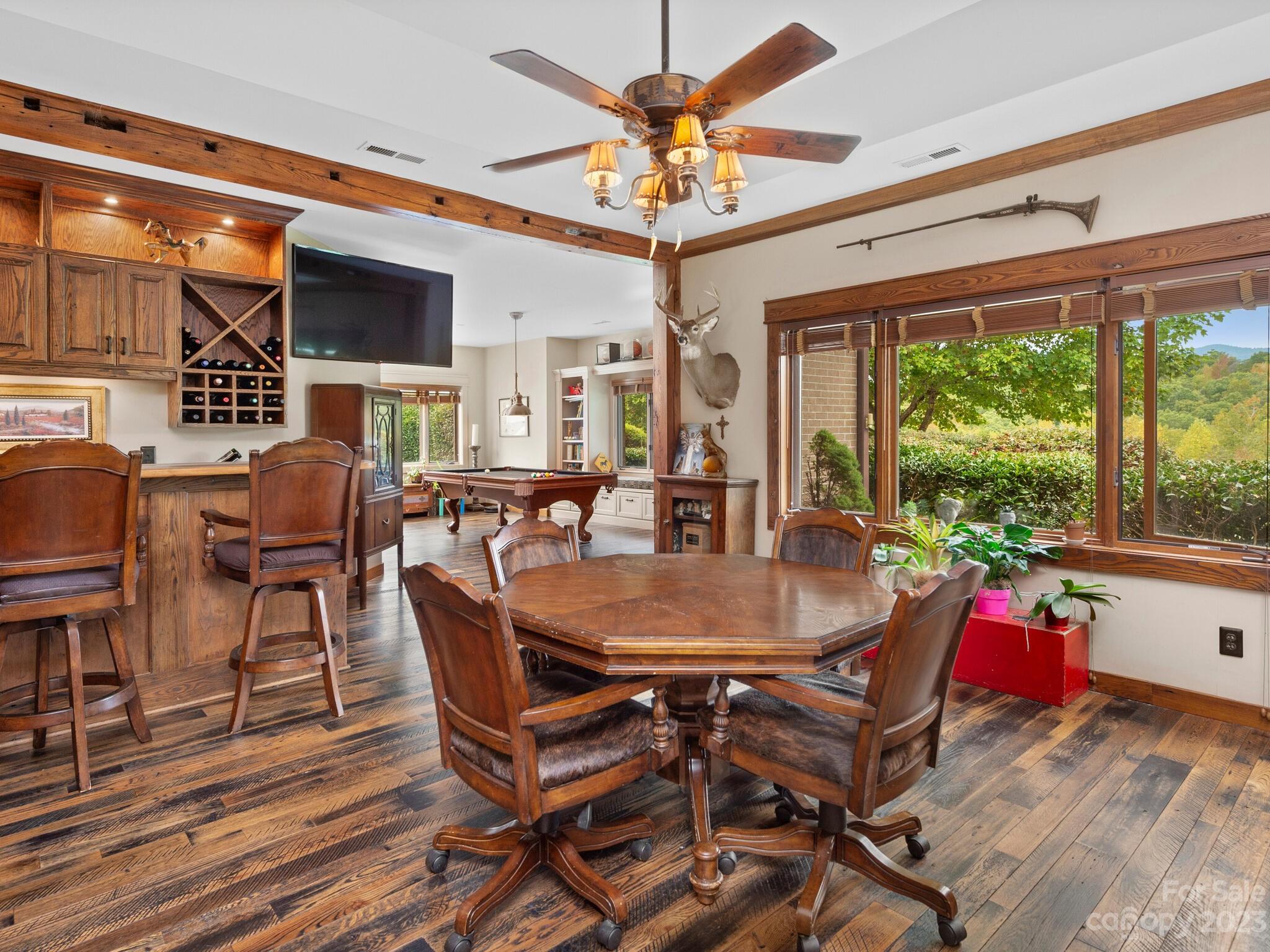 574 Golden Road Columbus, NC 28722 - Photo 26 of 48 a view of a dining room with furniture window and outside view