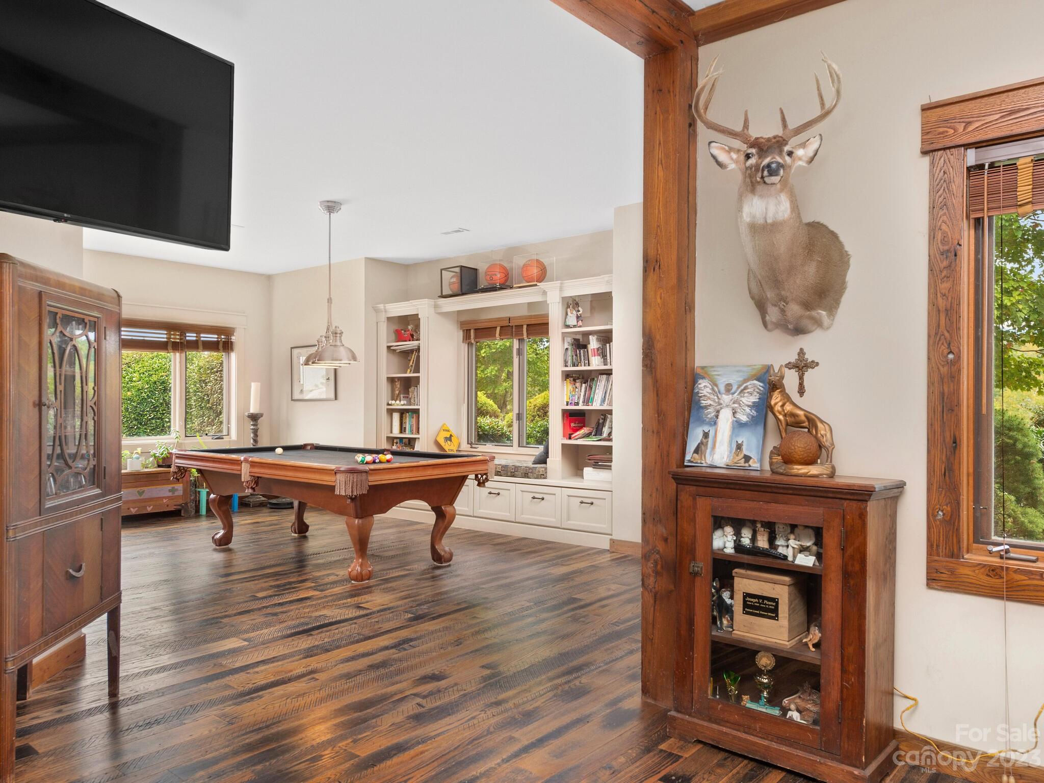 574 Golden Road Columbus, NC 28722 - Photo 27 of 48 a living room with furniture a window and a flat screen tv