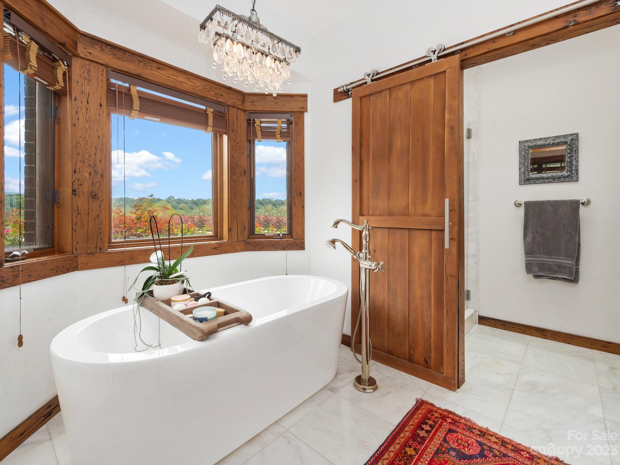 574 Golden Road Columbus, NC 28722 - Photo 33 of 48 a bath tub sitting next to a window