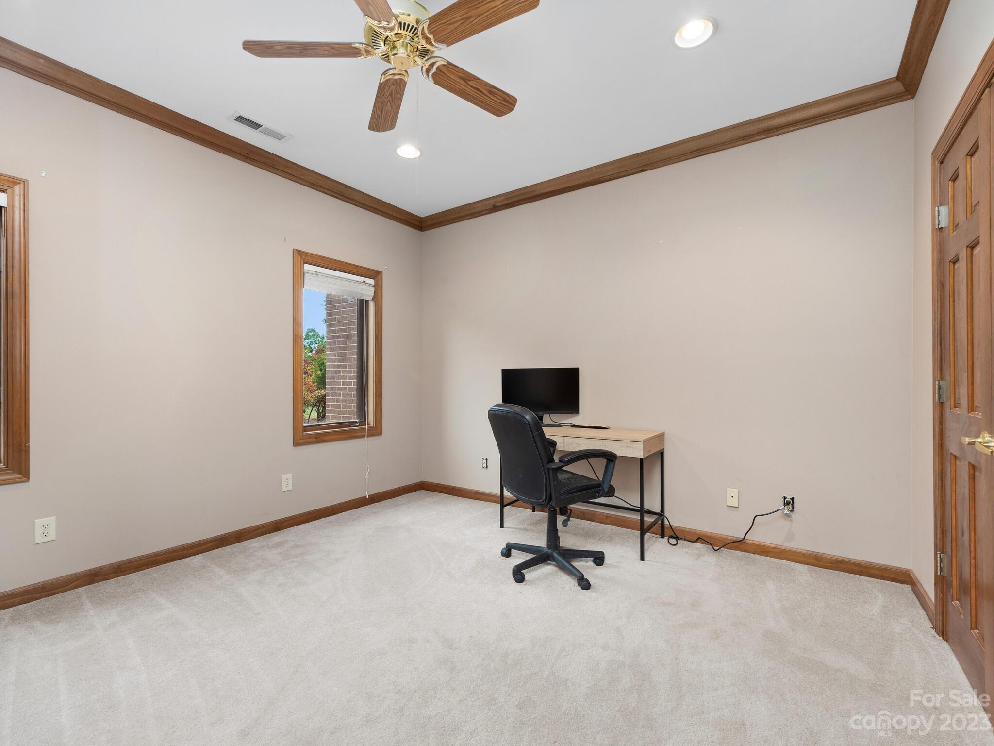574 Golden Road Columbus, NC 28722 - Photo 40 of 48 a view of a workspace with furniture and a window