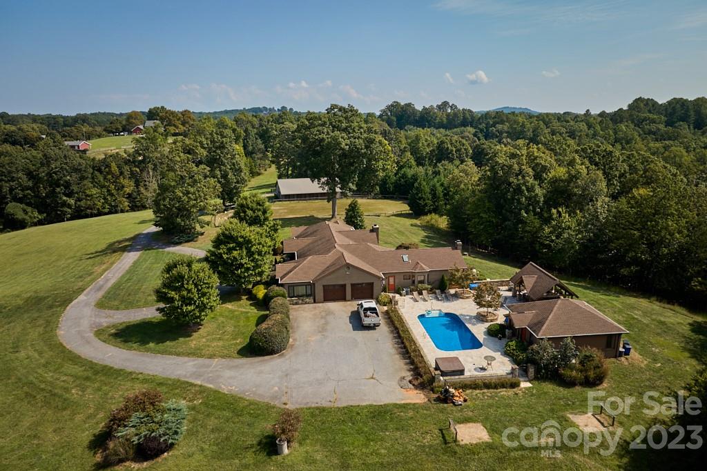 574 Golden Road Columbus, NC 28722 - Photo 4 of 48 an aerial view of a swimming pool with a yard