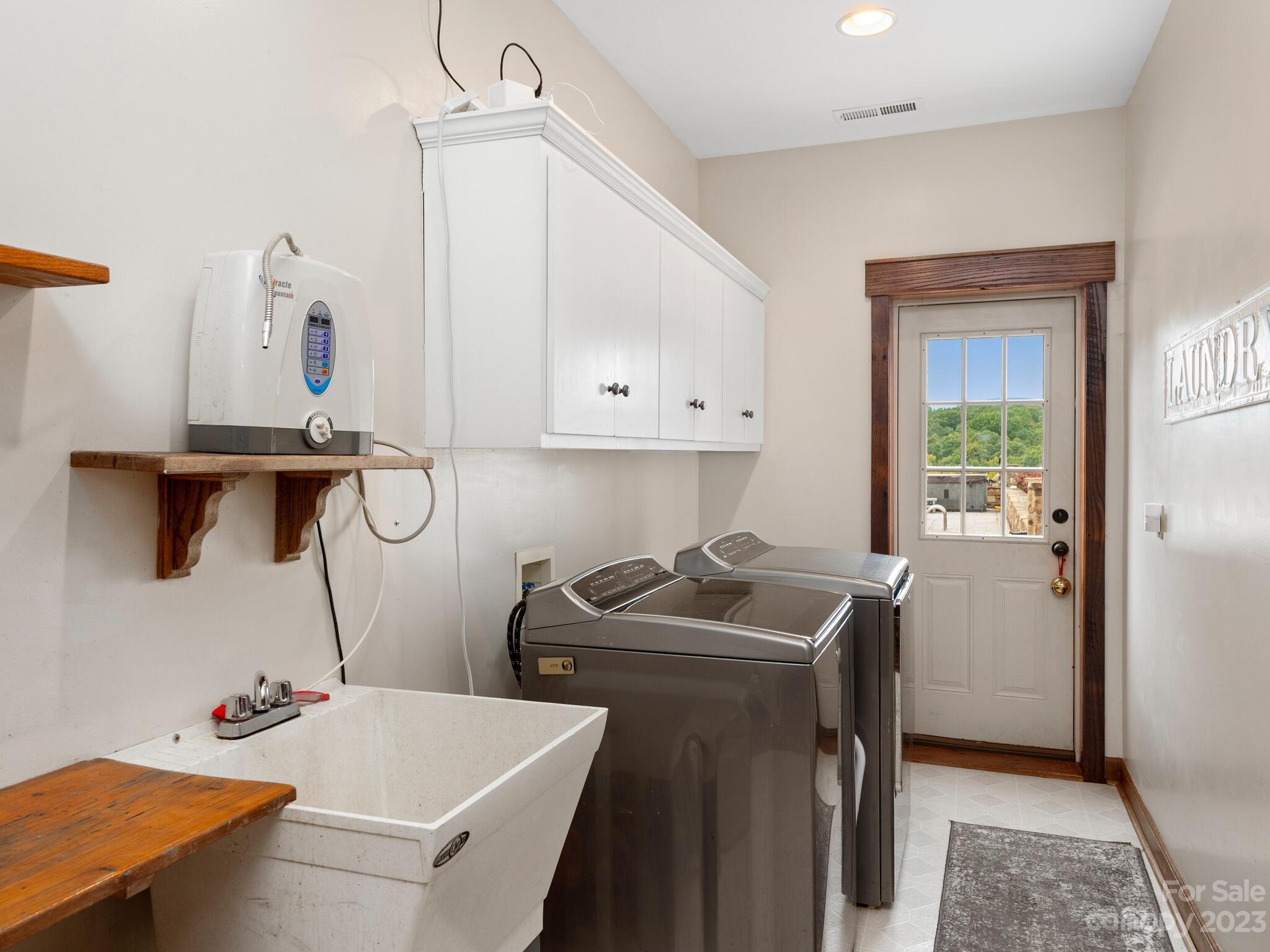 574 Golden Road Columbus, NC 28722 - Photo 41 of 48 a room with a sink cabinets and utility room