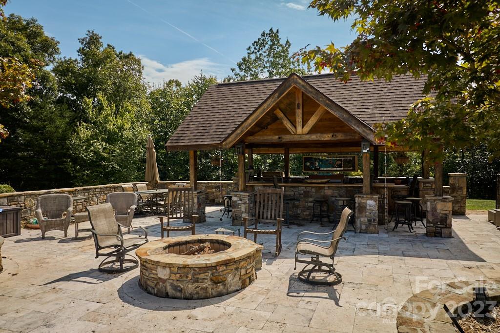 574 Golden Road Columbus, NC 28722 - Photo 9 of 48 a patio with a table and chairs