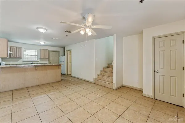 a view of a kitchen with cabinet and a window