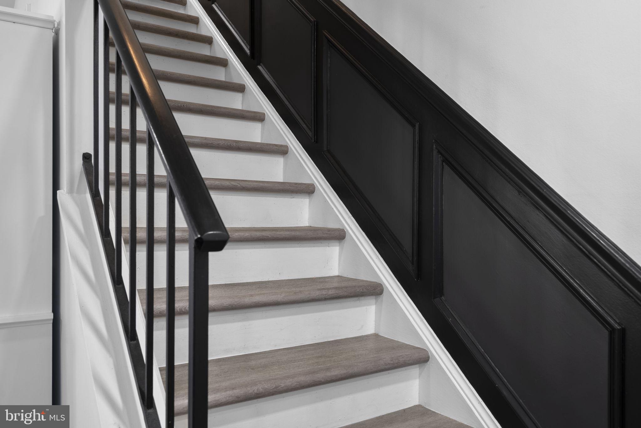 11317 Hawks Ridge Terrace, Unit 91 Germantown, MD 20876 - Photo 24 of 41 Elegant staircase with modern flair.