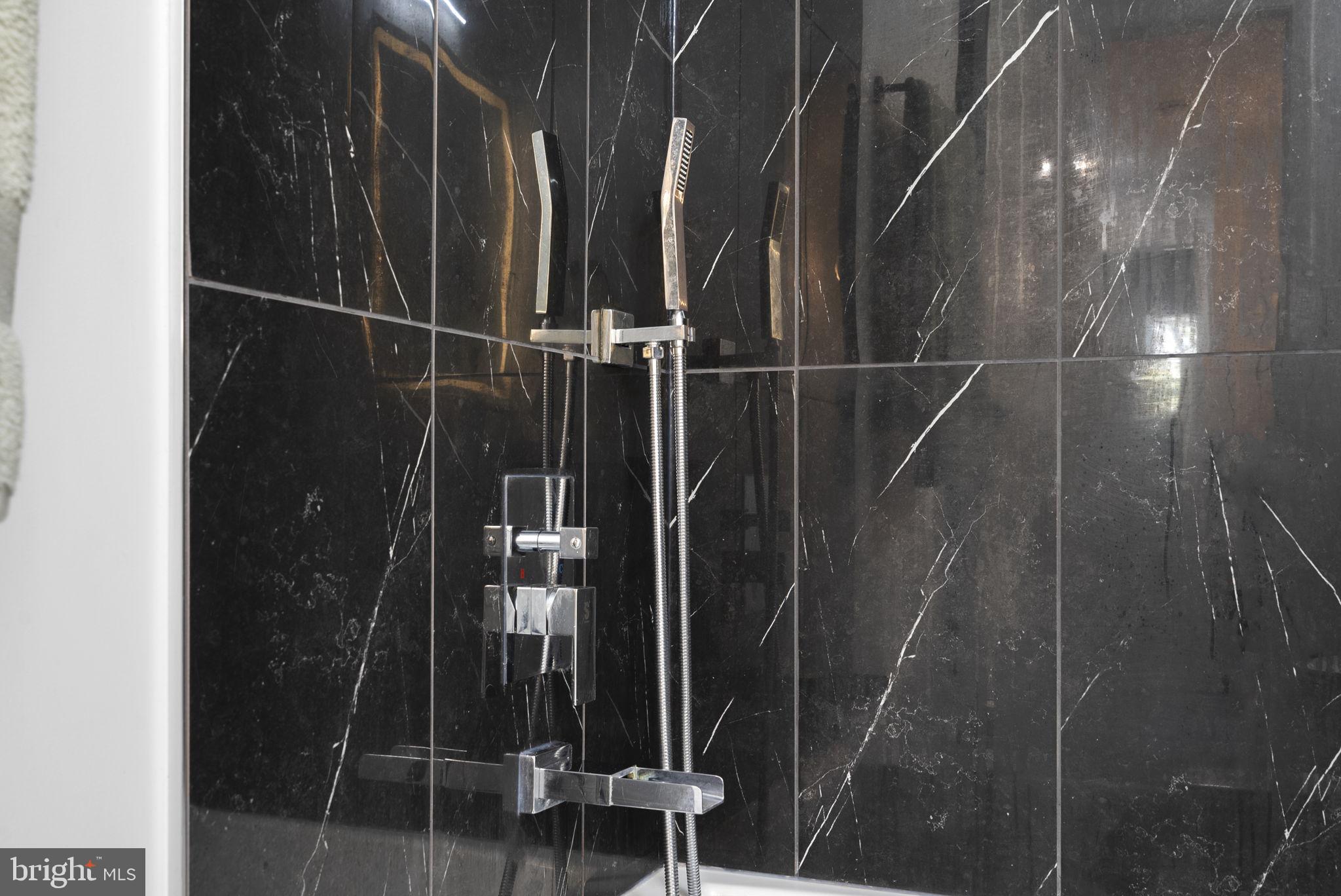 11317 Hawks Ridge Terrace, Unit 91 Germantown, MD 20876 - Photo 38 of 41 Sleek modern shower with elegant tiles.