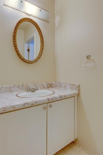 1900 Richard Jones Road, Unit V2 Nashville, TN 37215 - Photo 11 of 23 a bathroom with a granite countertop sink and a mirror
