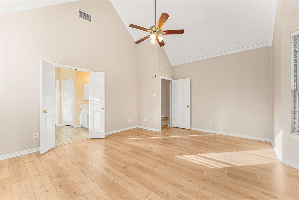 111 Midcrest Drive Irving, TX 75063 - Photo 12 of 26 a view of a livingroom with a ceiling fan and wooden floor