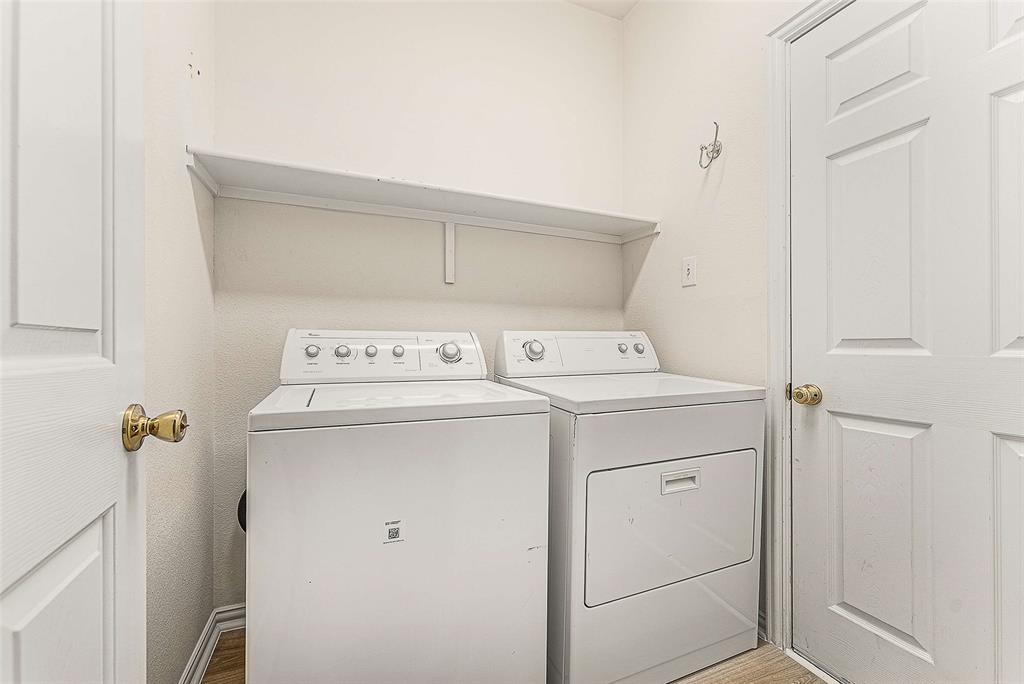 111 Midcrest Drive Irving, TX 75063 - Photo 21 of 26 a utility room with dryer and washer