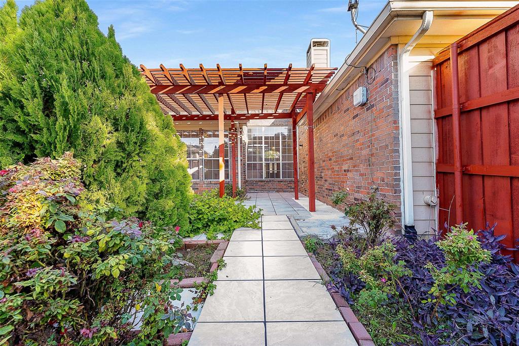111 Midcrest Drive Irving, TX 75063 - Photo 24 of 26 a view of a pathway with an entrance