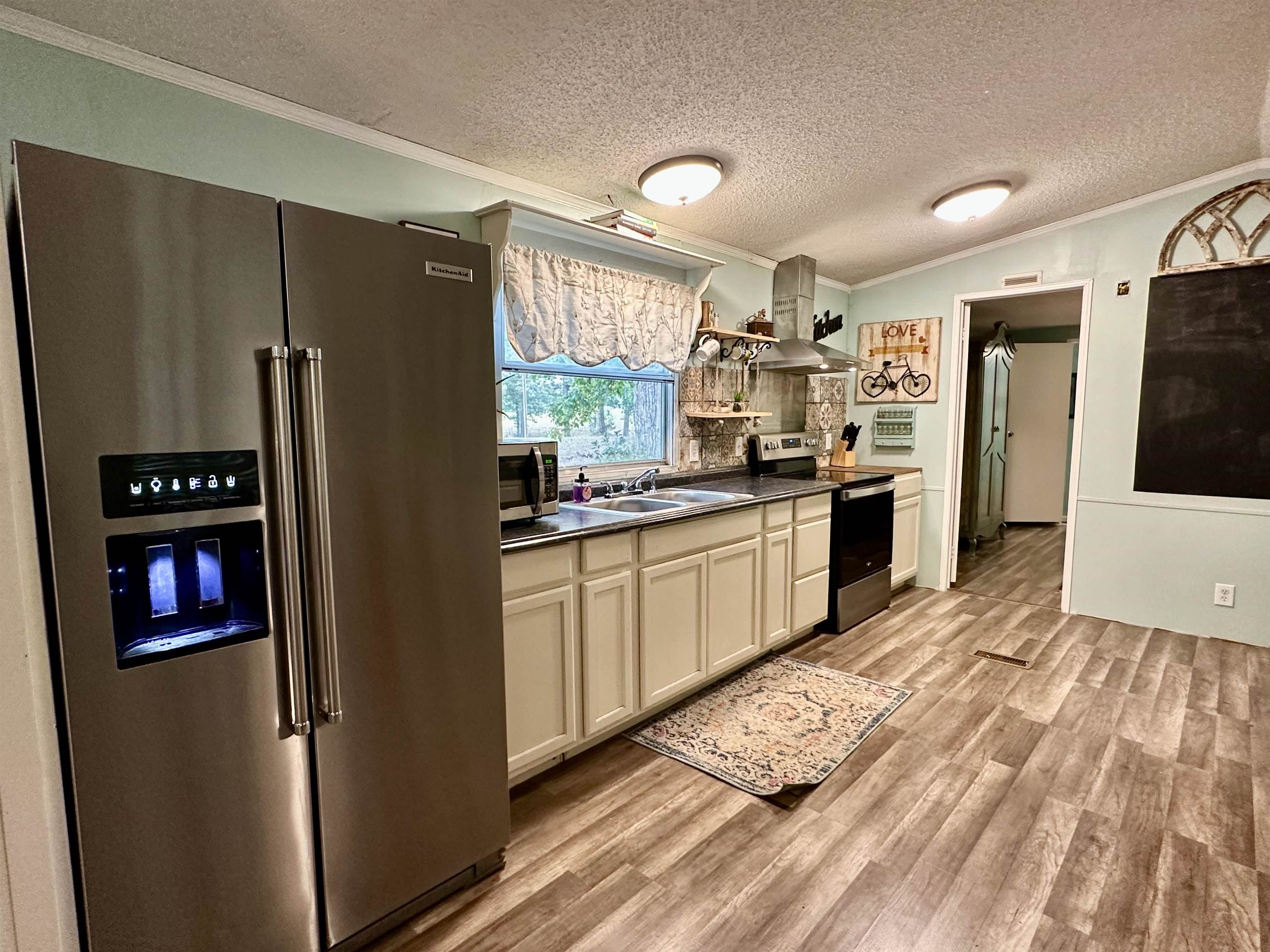 530 Poole Road Moscow, TN 38057 - Photo 11 of 20 Renovated with SS Appliances, floors, paint, backsplash and lighting.