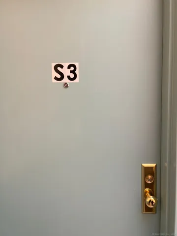 a kitchen with kitchen island wooden cabinets and granite counter top