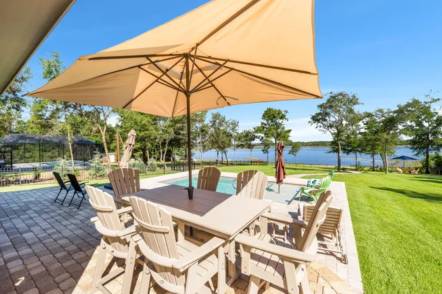 a living room filled with furniture and a large window