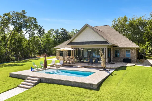 a view of a swimming pool with a patio