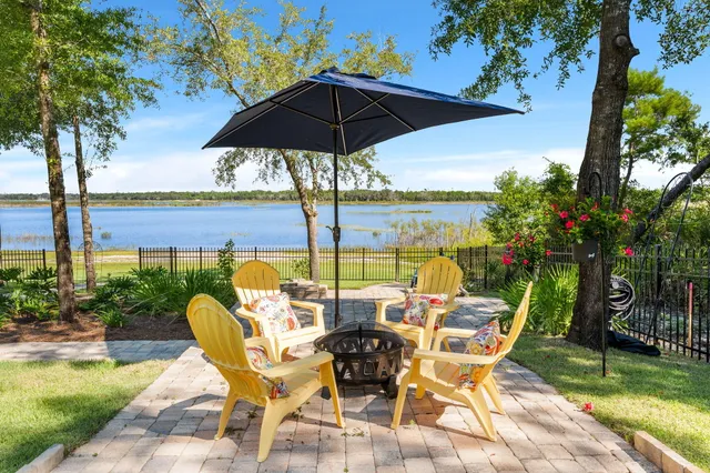 a kitchen with stainless steel appliances granite countertop a refrigerator and a stove