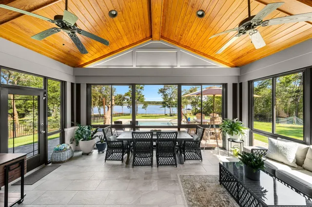 a swimming pool with outdoor seating and yard