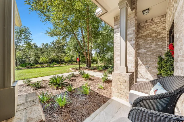 a spacious bedroom with a bed couch and a window