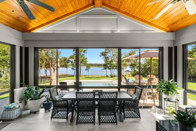 a spacious bathroom with a granite countertop sink mirror and a shower