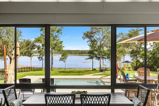 a bathroom with a tub shower and a sink