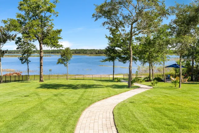 a view of a swimming pool with an outdoor space and seating area
