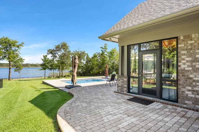 a front view of a house with garden and porch