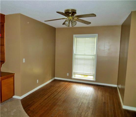 125 Hunter Road Fayetteville, TN 37334 - Photo 12 of 14 an empty room with wooden floor and door