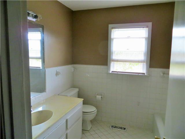 125 Hunter Road Fayetteville, TN 37334 - Photo 8 of 14 a bathroom with a sink a toilet and window