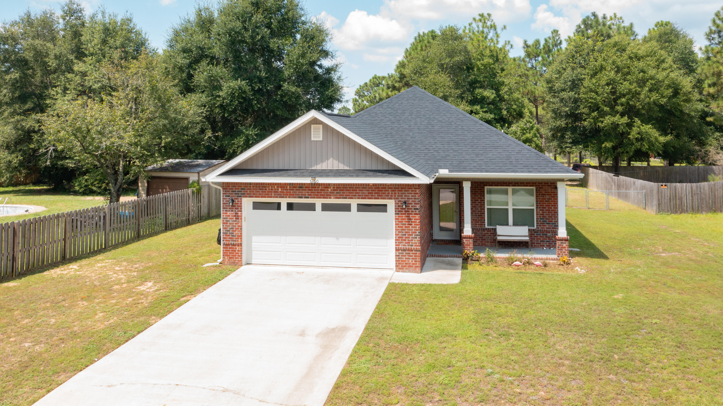6160 Hayes Drive Crestview, FL 32539 - Photo 1 of 45 a view of a house with pool and a yard