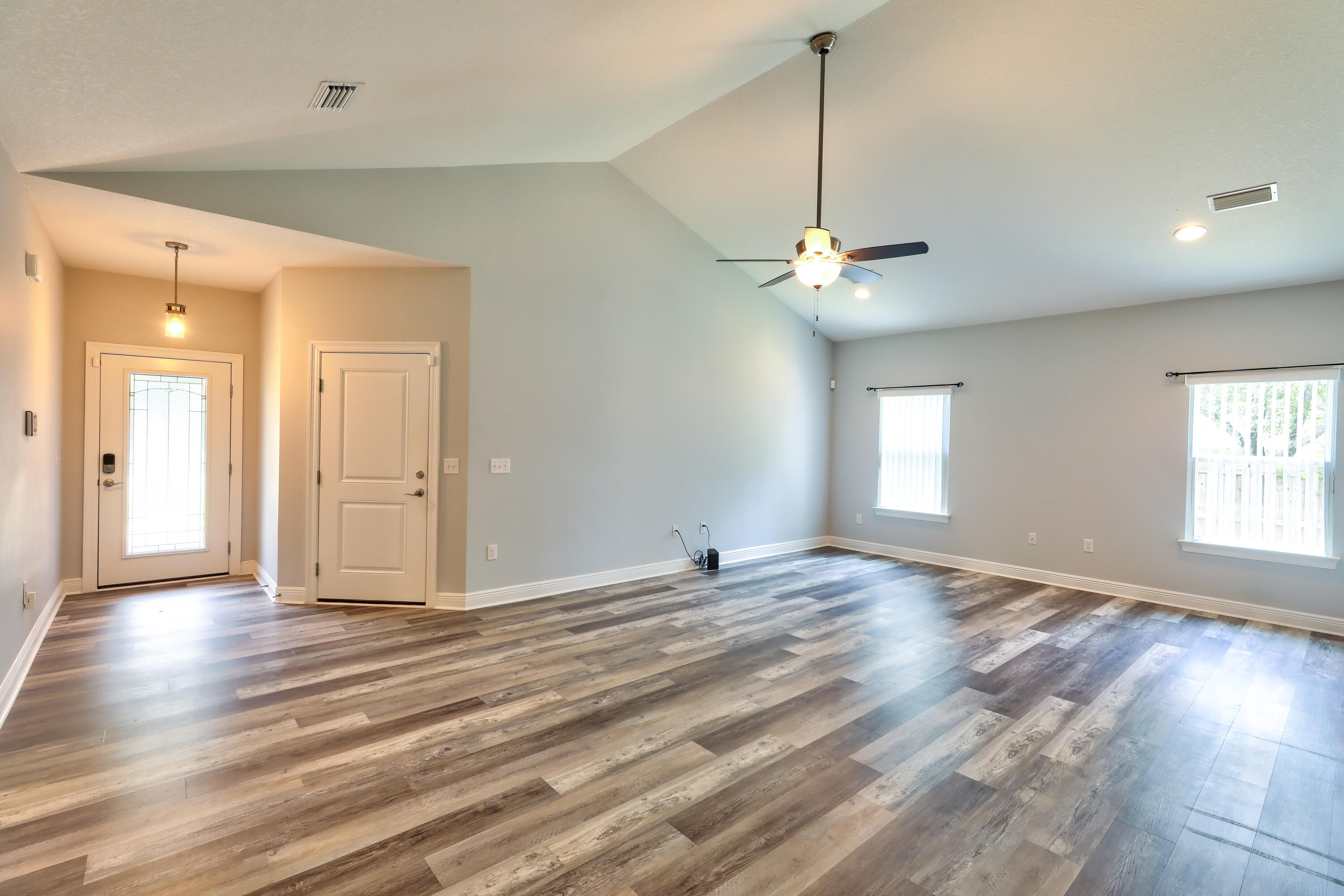 6160 Hayes Drive Crestview, FL 32539 - Photo 15 of 45 a view of a livingroom with a ceiling fan and window