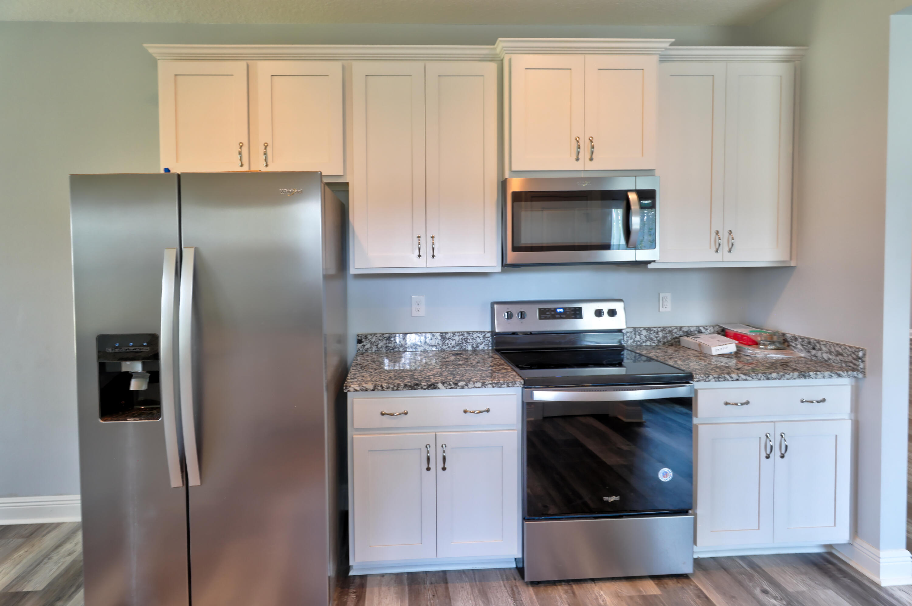 6160 Hayes Drive Crestview, FL 32539 - Photo 21 of 45 a kitchen with stainless steel appliances granite countertop a stove a refrigerator and a cabinets